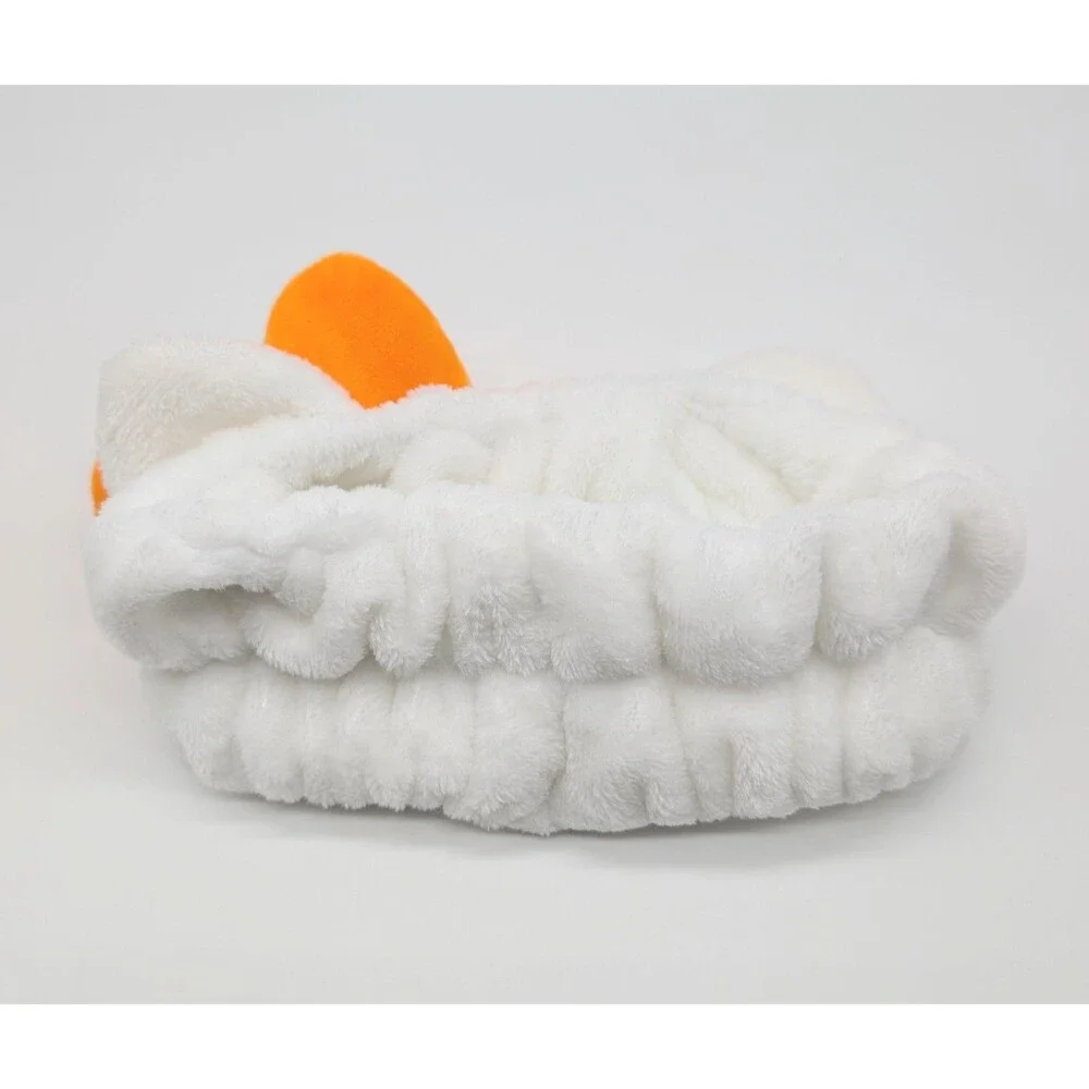 the CREME Hello Kitty Halloween Plush Spa Headband with Candy Corn Bow Limited